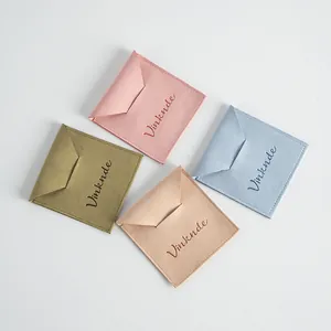 Set of four microfiber jewelry pouches in different colors with envelope flap closure