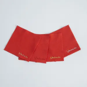 Detail of red microfiber jewelry cleaning cloths with embossed Vinknde metallic logo