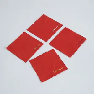 Macro detail of four red microfiber cleaning cloths for jewelry, watches, and phones