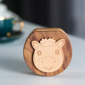 Detail of wooden baby hair storage box with cute cartoon horse carving