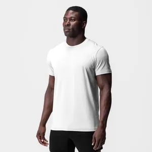 Detail view of a white slim-fit crew neck athletic t-shirt on a muscular male model.
