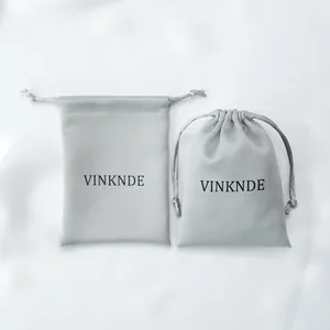 Premium silky gray satin drawstring storage bag for travel and jewelry gift packaging.
