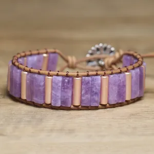 Detailed view of handmade purple natural stone bohemian wrap bracelet with rose gold beads
