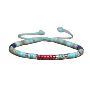 Pulsera artesanal ajustable de piedra natural imperial con cuentas turquesas y rojas