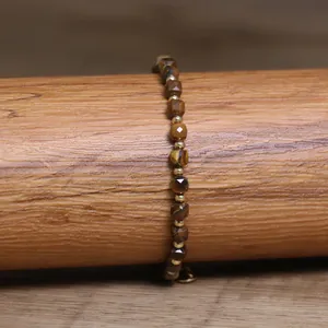 Close-up of faceted natural tiger eye stone beads on a 4*6mm handmade bracelet