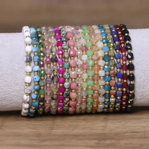 Detailed macro view of vibrant 4x6mm natural stone and crystal beaded bracelets on roll