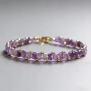 Elegant purple Tila bead bracelet with gold accents and woven Miyuki beads for women
