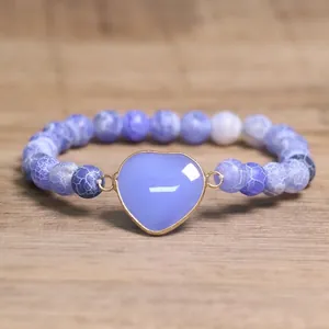 Close-up of 8mm blue cracked agate beaded bracelet with heart-shaped stone pendant