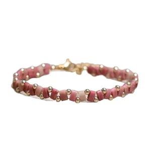 Elegant handmade pink Tila and gold bead woven bracelet with an adjustable clasp