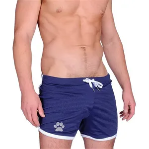 Detailed view of navy blue mesh men's sports shorts with breathable fabric and paw print