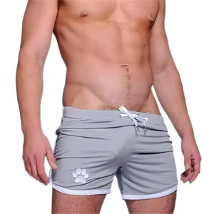 Athletic men's gray breathable mesh gym shorts with white paw print and drawstring