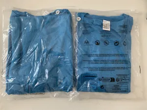 Detailed view of men's blue grid-textured quick-dry shirts in plastic packaging.