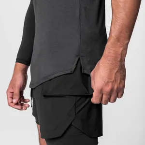 Close-up of quick-dry men's athletic shorts with split hem and grey top.