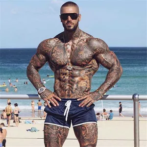 Pantalones cortos deportivos para hombre en azul marino de secado rápido usados en la playa