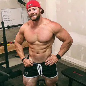 Close-up of quick-dry men's bodybuilding shorts with drawstring waist in gym setting