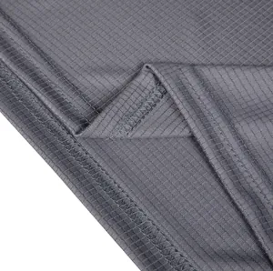 Close-up detail of grey small grid quick-dry fabric with professional stitching.