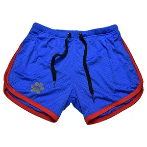 Close-up of blue mesh quick-dry men's athletic shorts with red trim and paw print