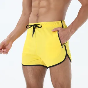 Vista detallada del pantalón corto deportivo amarillo para hombre con cordón y tejido de malla