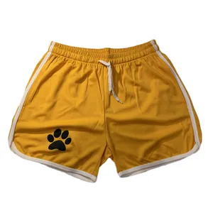 Gelbe Mesh-Sportshorts mit schwarzem Pfotenabdruck und weißem Besatz