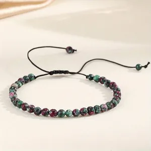Detail of 4mm natural green gemstone beaded adjustable woven cord bracelet