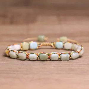 Close-up detail of adjustable handmade woven bracelet with 4mm natural tourmaline stone beads