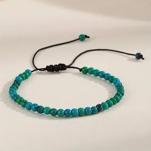 Detailed view of 4mm natural green agate beads on an adjustable cord bracelet