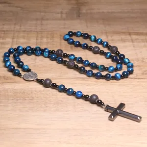 Detailed view of blue tiger eye and lava stone rosary necklace with a black cross