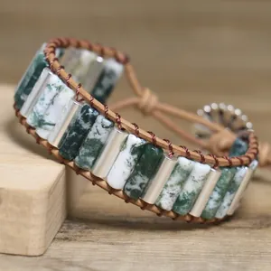 Detailed close-up of handmade moss agate stone leather wrap bracelet with metal clasp