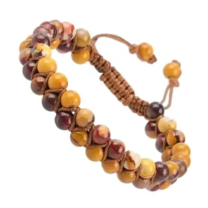 Detailed view of a double-row hand-woven natural stone adjustable bracelet with earthy tones