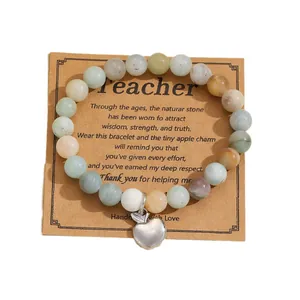 Natural stone beaded bracelet with silver apple charm on a Teacher appreciation card
