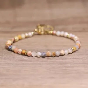 Detailed close-up of natural faceted stone beads on a handmade bohemian bracelet