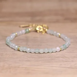 Close-up of bohemian faceted natural stone beaded bracelet with adjustable gold chain