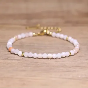Macro view of faceted pink natural stone beads on a Bohemian style handmade adjustable bracelet