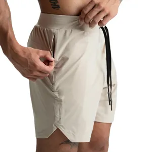 Pantaloncini fitness beige da uomo ad asciugatura rapida con tasca a zip.