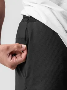 Pantaloncini sportivi mesh da uomo a rapida asciugatura con tasca laterale con cerniera