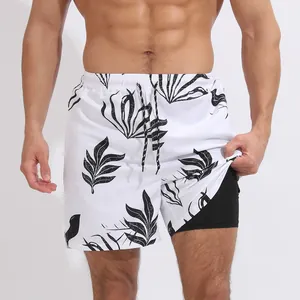 Short de plage double couche pour homme avec imprimé feuilles noires et cordon élastique