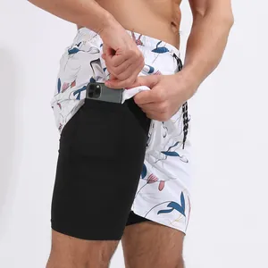Pantaloncini da spiaggia a doppio strato con stampa floreale e tasca interna per telefono