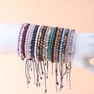 Detailed close-up showing a variety of 4mm natural stone beaded adjustable bracelets.