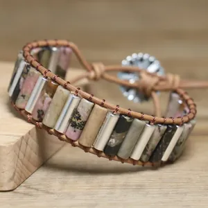 Detailed close-up of natural stone beads on a handmade bohemian wrap bracelet