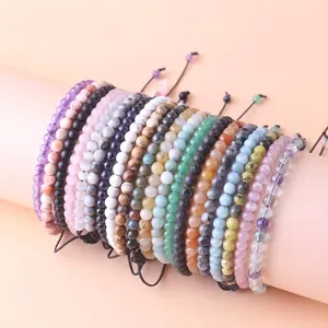 Detailed view of 4mm natural stone beaded bracelets with adjustable woven cords.