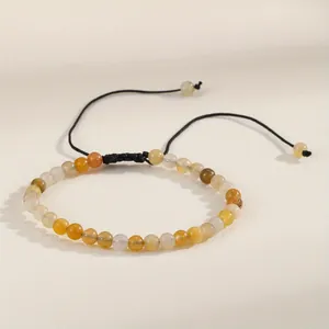 Detailed view of 4mm natural stone beaded bracelet with adjustable black woven cord