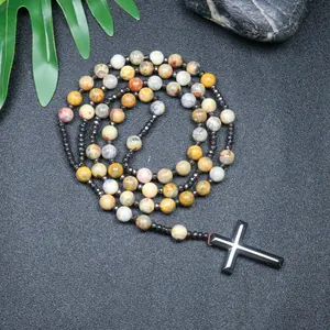 Detailed view of handmade crazy agate bead rosary necklace with hematite cross