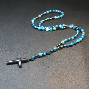 Detailed view of handmade natural blue striped agate beads and hematite cross
