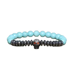 Gothic fashion skull bracelet featuring natural blue turquoise and faceted hematite beads