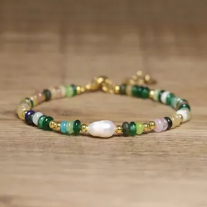 Detailed close-up view of handmade beaded bracelet with baroque pearl and colorful stones