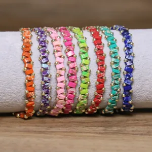 Close-up of colorful stone beaded elastic bracelets on a jewelry display stand