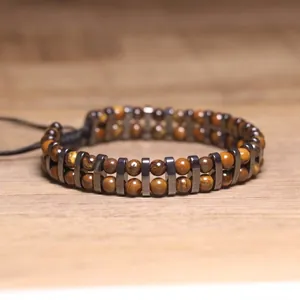 Macro detail showing the double-layer structure of tiger eye and hematite beads