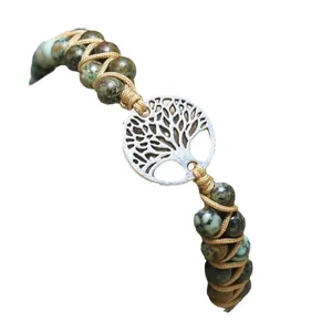 Handmade natural African pine stone beaded bracelet featuring a silver tree of life charm