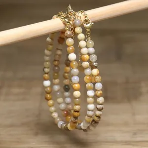 Detailed view of handmade natural stone beaded necklaces with gold extension chain.