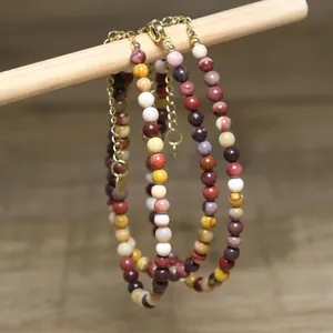Detailed view of the colorful natural stone beads and durable gold extension chain.